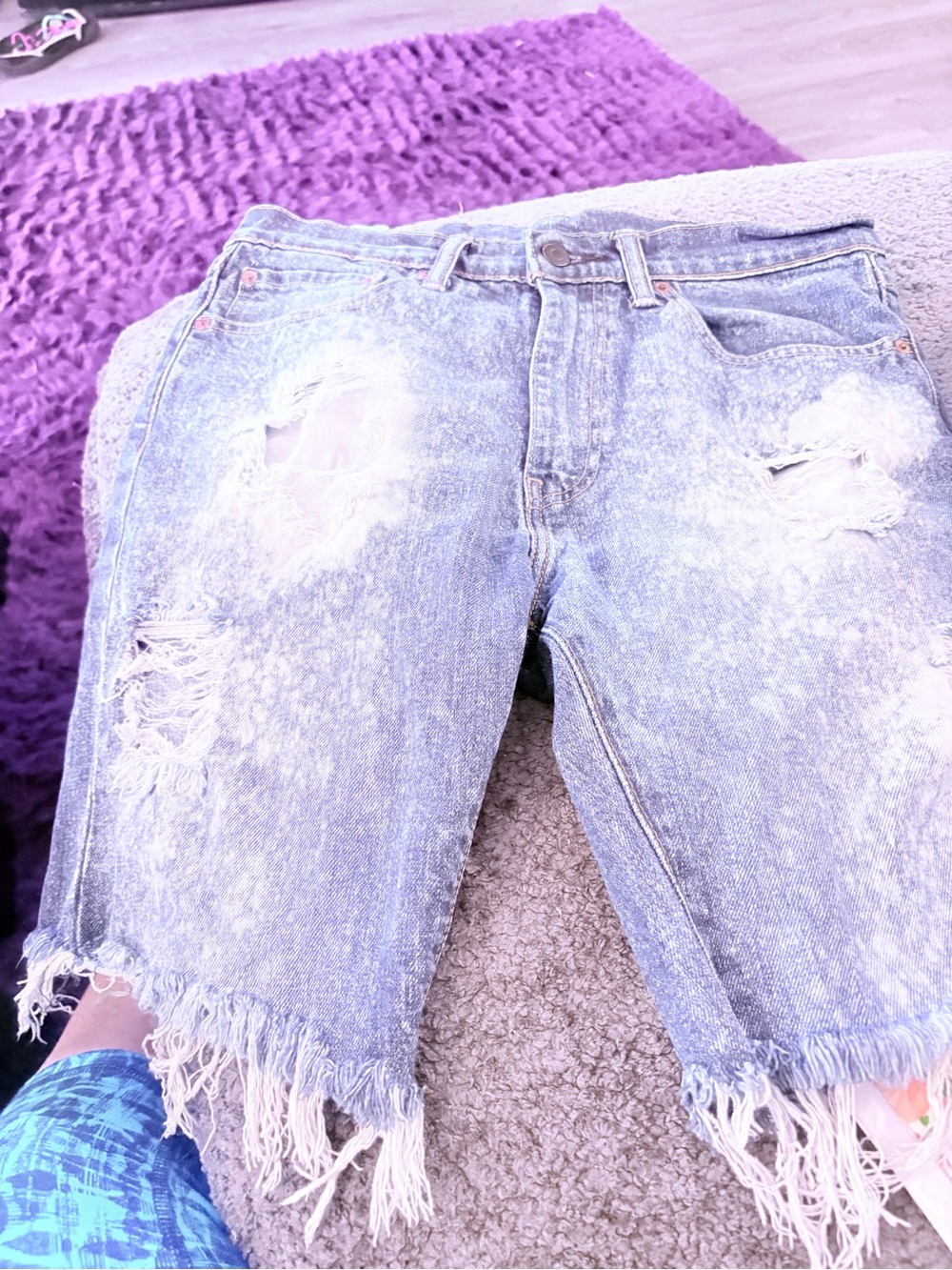 Levi's light blue denim shorts with frayed hem